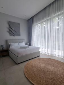 Postel nebo postele na pokoji v ubytování Villa Sharon