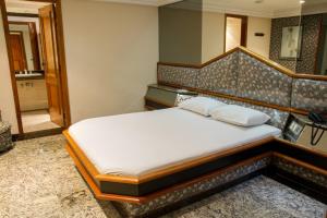 Кровать или кровати в номере Te Adoro Hotel (Adult Only)