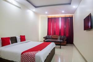 Ένα ή περισσότερα κρεβάτια σε δωμάτιο στο Hotel O Shivalaya