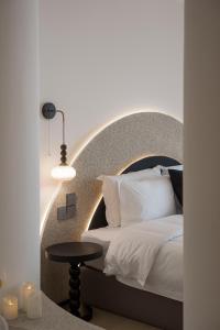 a bedroom with a bed and a table and candles at Town Designer B&B in Qingdao