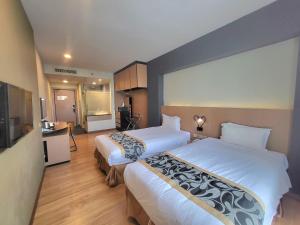 Postel nebo postele na pokoji v ubytování Roxy Hotel & Apartments