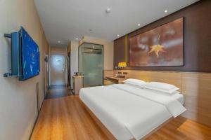 Postel nebo postele na pokoji v ubytování IU Hotels Xinzhou Bus Terminal + 37 fotografií