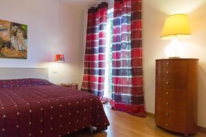 Postel nebo postele na pokoji v ubytování Guest House Le Acacie