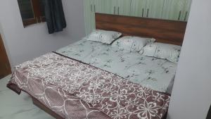 Ένα ή περισσότερα κρεβάτια σε δωμάτιο στο VS Homestay