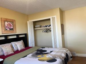 a bedroom with a bed and a book shelf at greenview mck sunny room in Calgary