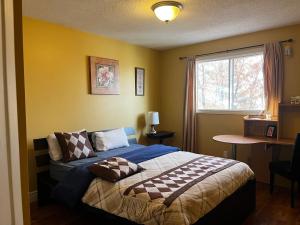 a bedroom with a bed and a window at greenview mck sunny room in Calgary