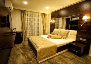 Кровать или кровати в номере Venus Suite Hotel