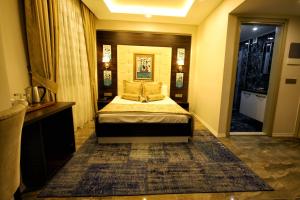 Кровать или кровати в номере Venus Suite Hotel