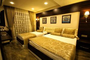 Кровать или кровати в номере Venus Suite Hotel