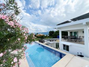 a view of the swimming pool of a villa at Villa Bor a Mar - Holiday homes in Puerto Galera