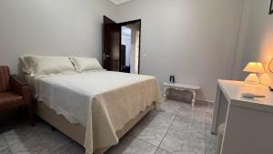 Postel nebo postele na pokoji v ubytování Aconchegante Apartamento de 2 Quartos