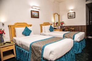 Postel nebo postele na pokoji v ubytování Golden Parkk Hotel + 37 fotografií