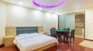 Ένα ή περισσότερα κρεβάτια σε δωμάτιο στο GreenTree Inn Wuhu Fangte Second Phase Nanxiang Wanshang Express Hotel