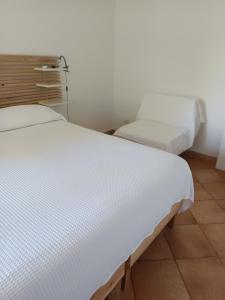 Postel nebo postele na pokoji v ubytování B&B Denteferro