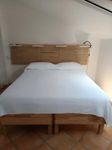 Postel nebo postele na pokoji v ubytování B&B Denteferro