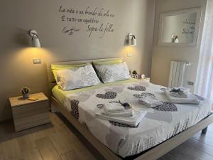 Ένα ή περισσότερα κρεβάτια σε δωμάτιο στο Casa vacanze “Dolce sosta”