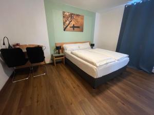 Postel nebo postele na pokoji v ubytování Residenz Hotel Wuppertal