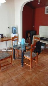 a dining room with a glass table and chairs at Villa Kota Bunga Q4-17 in Cikundul