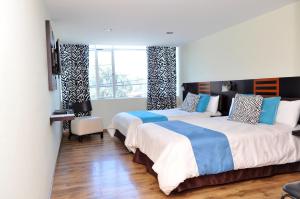 Postel nebo postele na pokoji v ubytování Hotel de las Américas - Ambato + 37 fotografií
