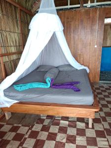 Postel nebo postele na pokoji v ubytování Saukabu Homestay