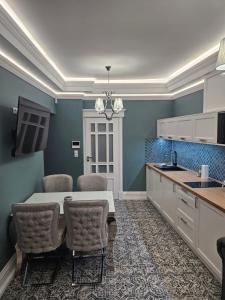 a kitchen with a table and chairs in a room at Apartament Twin II in Żywiec