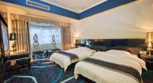 Un ou plusieurs lits dans un hébergement de l'établissement Guilin Sapphire hotel