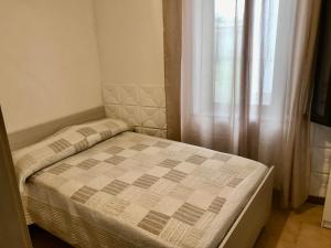Ένα ή περισσότερα κρεβάτια σε δωμάτιο στο Casa Tre Fontane