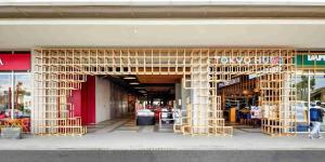 a store front with a wooden structure in front of it at Tokyo Riverside PIK 2 by Kakarama Room in Muara