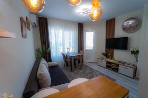 a living room with a couch and a table at YaVi's Central Apartment in Veliko Tŭrnovo
