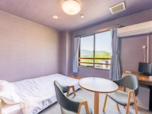 A bed or beds in a room at RV park plus Numata Kenko Land