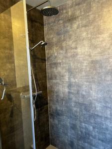 a shower with a glass door in a bathroom at Charming Family Villa in Ulricehamn +31 photos