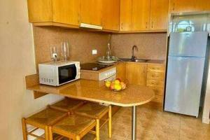 Kuchyň nebo kuchyňský kout v ubytování SON BOU Apartamento en planta baja junto la playa