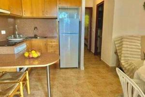 Kuchyň nebo kuchyňský kout v ubytování SON BOU Apartamento en planta baja junto la playa