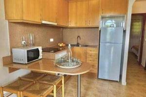 Kuchyň nebo kuchyňský kout v ubytování SON BOU Apartamento en planta baja junto la playa
