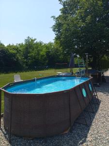 a swimming pool with a fence around it at Cabana Diana in Avrig