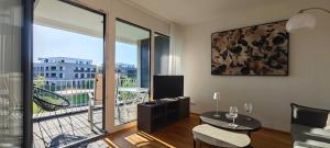 a living room with a view of a balcony at Ferienwohnung Seemöwe in Salem