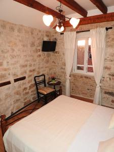 Postel nebo postele na pokoji v ubytování Guest House Tragurion