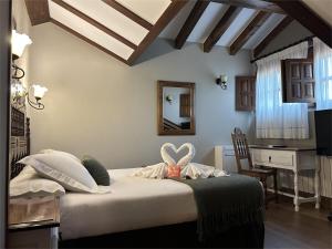 Televízia a/alebo spoločenská miestnosť v ubytovaní Posada Spa San Marcos