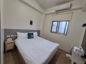 Uma cama ou camas num quarto em 幸運草輕旅