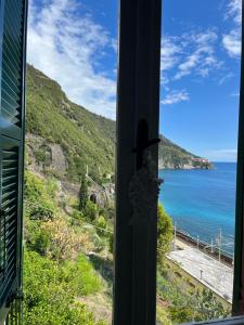 a view of the ocean from a window at La Scuna Guest House in Corniglia