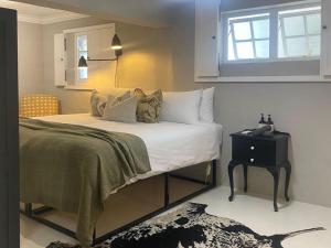 Ένα ή περισσότερα κρεβάτια σε δωμάτιο στο Mount Grace Country House