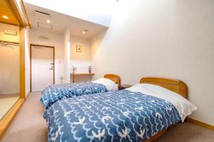 Letto o letti in una camera di 温泉御宿 るりびたき