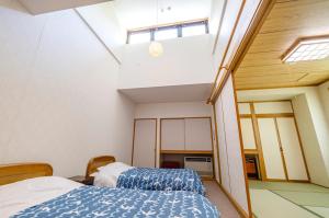 Letto o letti in una camera di 温泉御宿 るりびたき