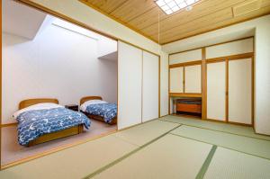Letto o letti in una camera di 温泉御宿 るりびたき