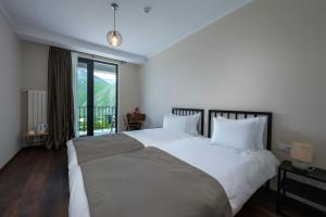 Katil atau katil-katil dalam bilik di Residence Kazbegi