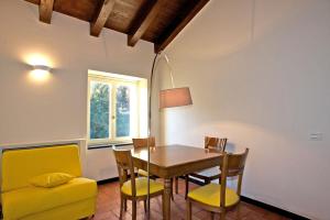 a dining room with a table and chairs and a window at Albergo Palazzo Costa in Beverino