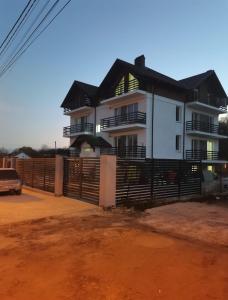 a house with a fence in front of it at Тихое место 