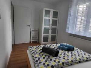 a bedroom with a bed with two pillows on it at Bodensee Idylle in Friedrichshafen