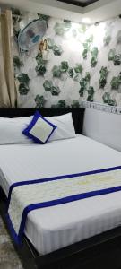 Ένα ή περισσότερα κρεβάτια σε δωμάτιο στο Hotel giathinh