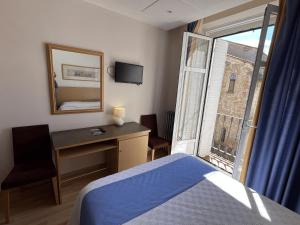 Ένα ή περισσότερα κρεβάτια σε δωμάτιο στο Hotel España